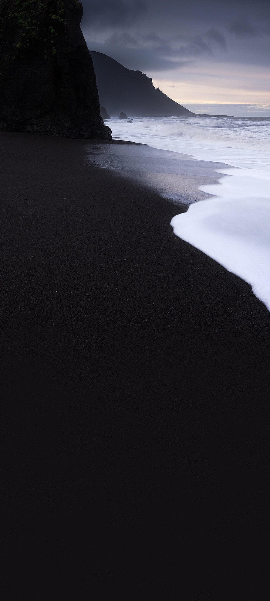 Dramatic Black Sand Beach with Crashing Waves and Dark Cliffs at Dusk HD phone wallpaper