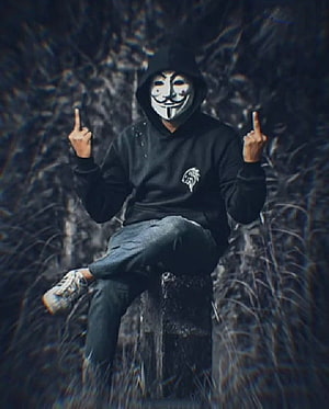 Anonymous Hacker Wearing Guy Fawkes Mask and Black Hoodie Sitting on Concrete Block HD phone wallpaper