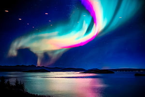 Vibrant Aurora Borealis Over Calm Lake With Mountain Silhouettes HD wallpaper