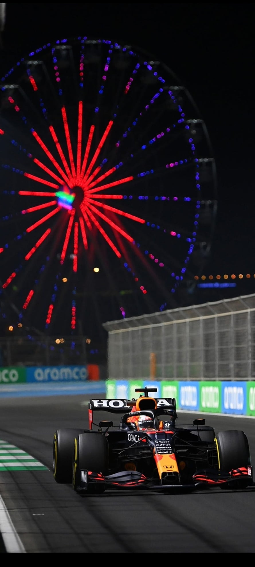 Max Verstappen Red Bull Racing Formula 1 Car at Night with Illuminated Ferris Wheel HD phone wallpaper