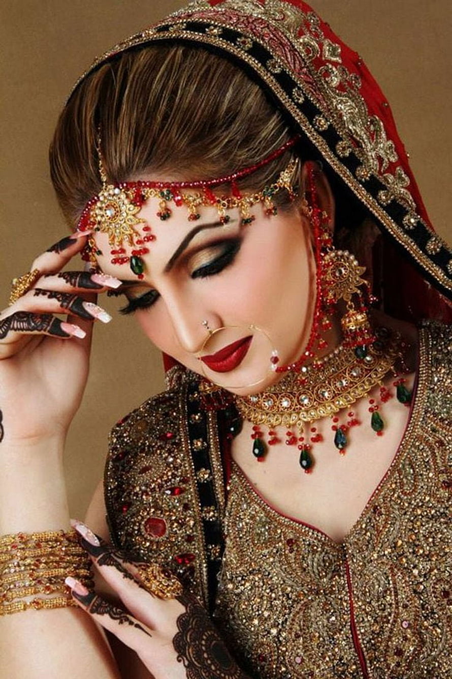 Elegant Indian Bride in Traditional Red and Gold Wedding Attire with Intricate Jewelry HD phone wallpaper
