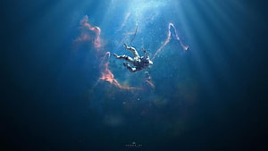 Astronaut Drifting Through Deep Blue Nebula with Ethereal Light Rays HD wallpaper