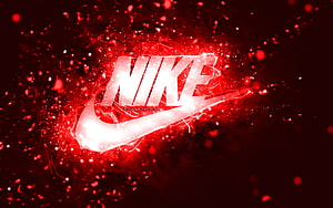 Glowing Red Nike Logo With Sparkling Particles And Dynamic Energy Effects HD wallpaper
