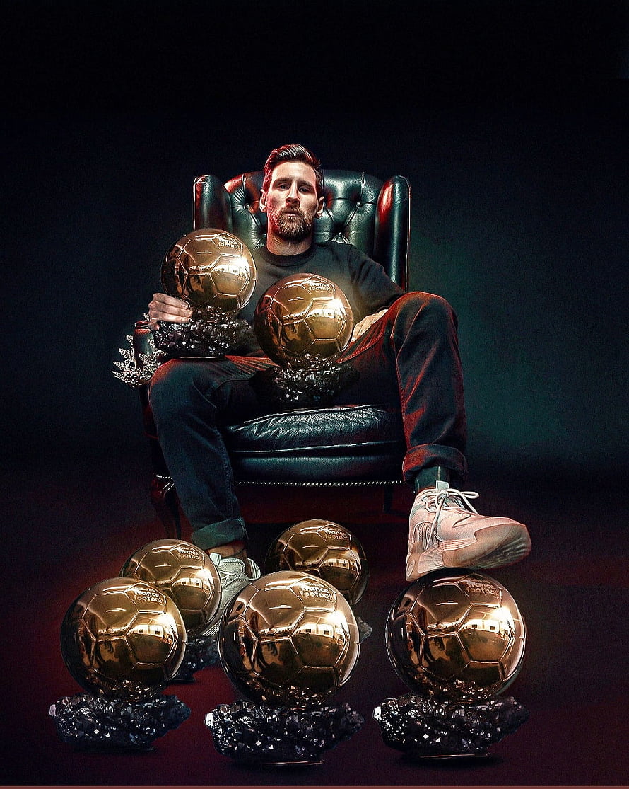Lionel Messi Sitting With Multiple Ballon d'Or Trophies in a Leather Chair HD phone wallpaper
