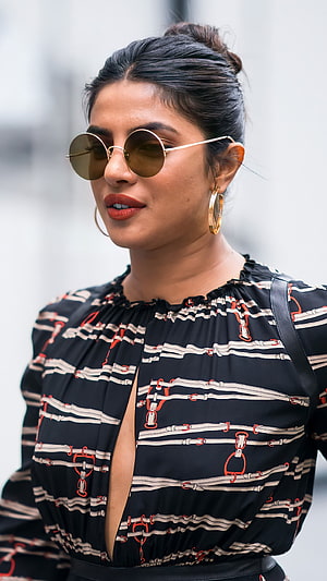 Priyanka Chopra Wearing Round Sunglasses and Gold Hoop Earrings in a Patterned Blouse HD phone wallpaper