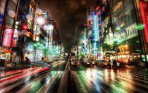 Vibrant Tokyo Street Scene at Night with Neon Lights and Rain Reflections HD wallpaper