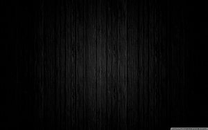 Dark Charcoal Wood Grain Texture with Vertical Planks and Subtle Natural Patterns HD wallpaper