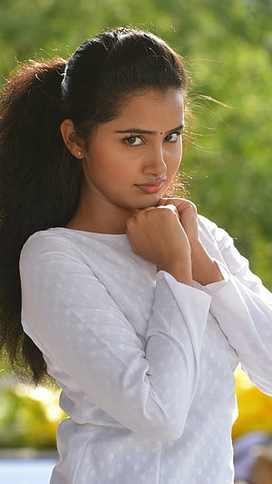 Anupama Parameswaran Portrait in White Polka Dot Top with Ponytail HD phone wallpaper