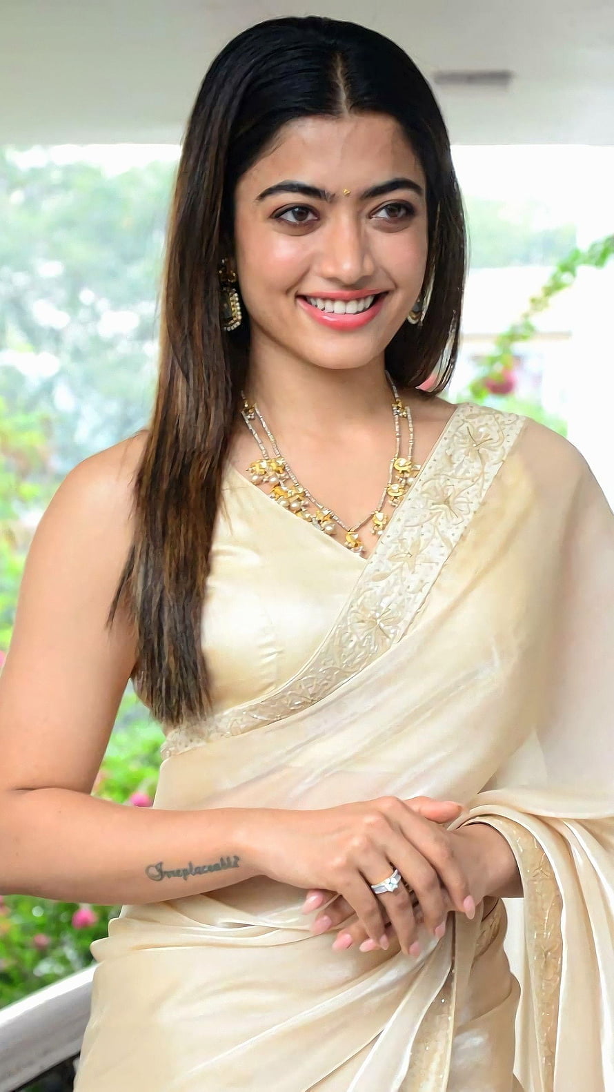 Pooja Hegde in a Cream Saree with Gold Jewelry and Smile HD phone wallpaper