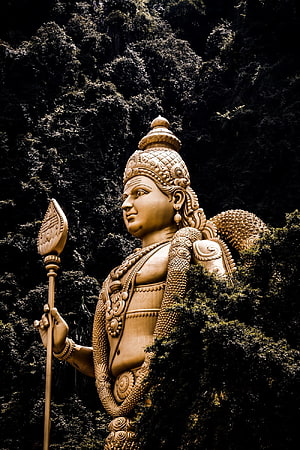 Lord Murugan Temple Statue Amidst Lush Green Foliage HD phone wallpaper