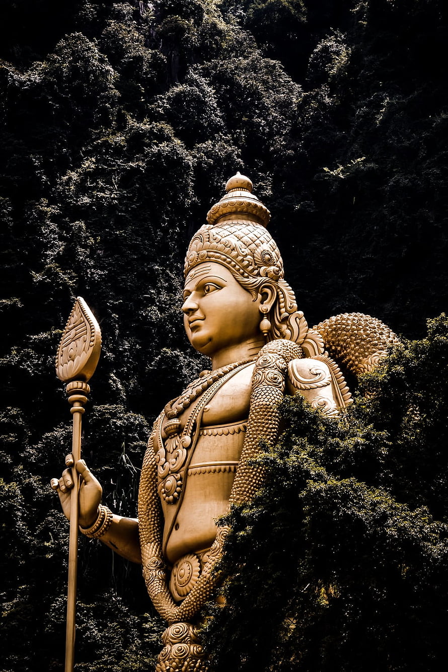 Lord Murugan Temple Statue Amidst Lush Green Foliage HD phone wallpaper