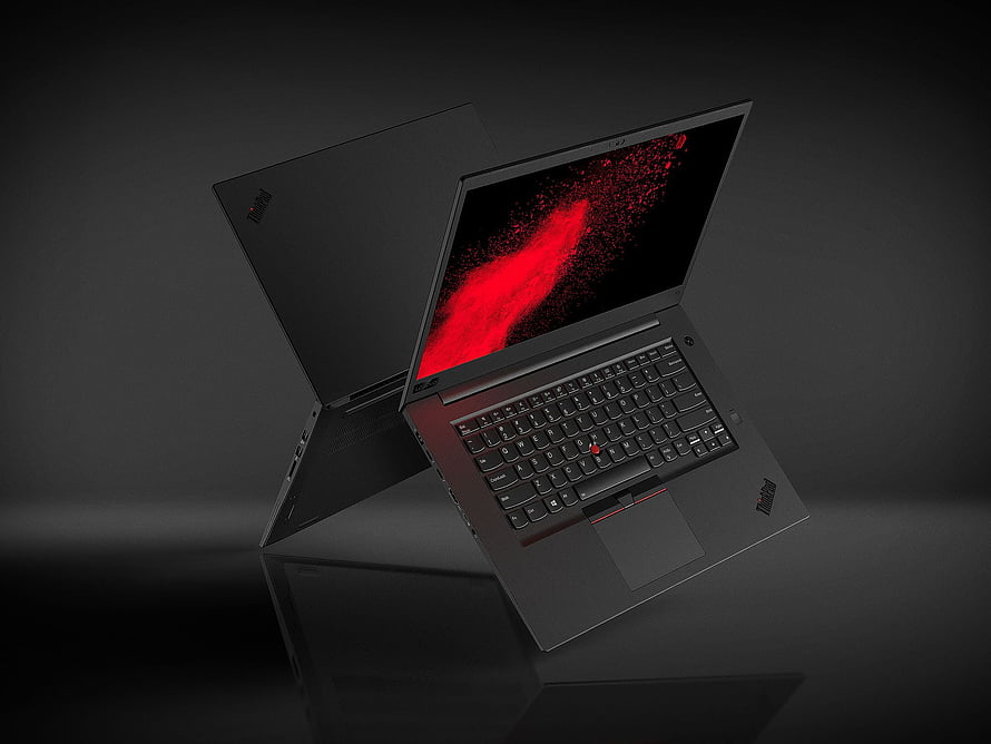 Lenovo ThinkPad X1 Extreme Laptop with Red Particle Display on Dark Background HD wallpaper