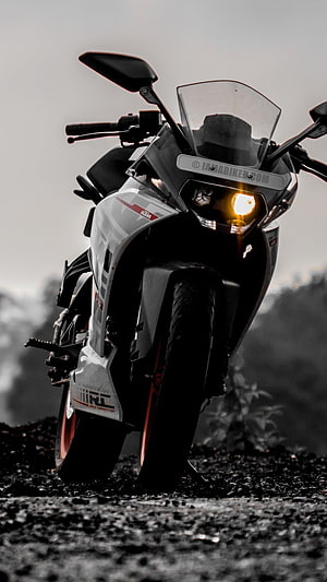 KTM RC 390 Sport Motorcycle Front View with Headlight on Gravel Road HD phone wallpaper