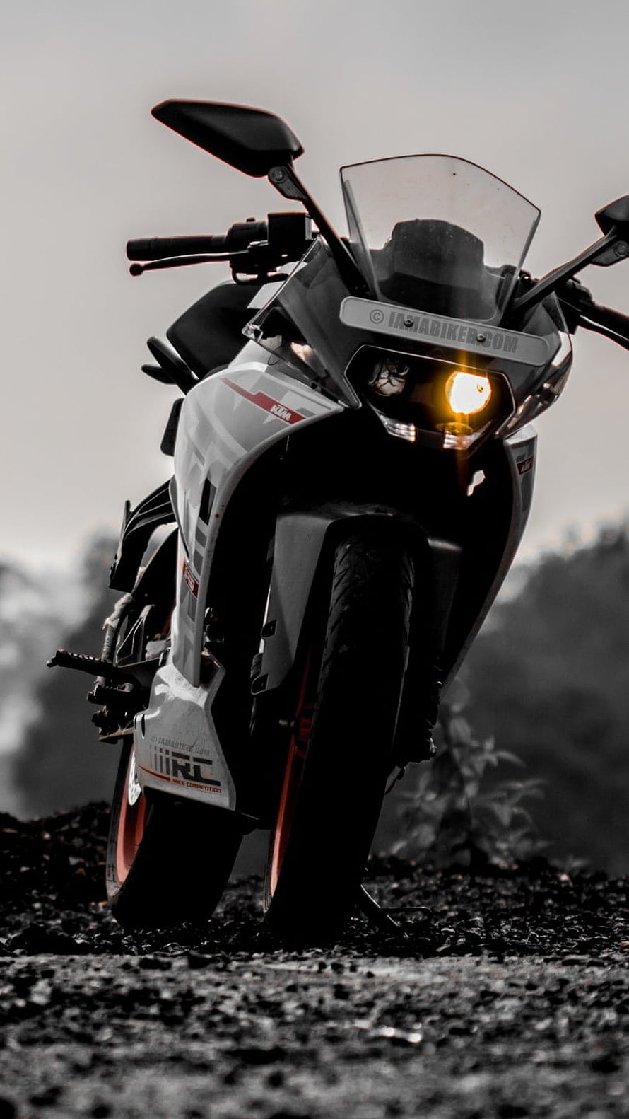 KTM RC 390 Sport Motorcycle Front View with Headlight on Gravel Road HD phone wallpaper
