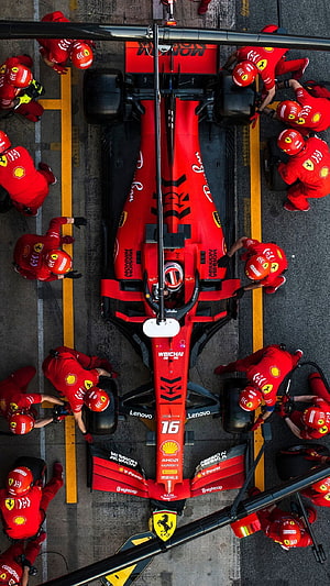 Ferrari F1 Pit Stop Crew Changing Tires on Red Race Car HD phone wallpaper