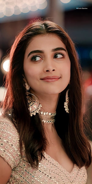 Pooja Hegde in a glamorous portrait wearing a sequined dress and traditional jewelry HD phone wallpaper