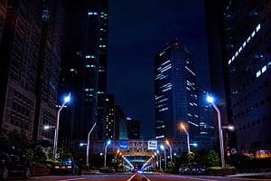 Tokyo Night Skyline with Illuminated Skyscrapers and Urban Street Lights HD wallpaper
