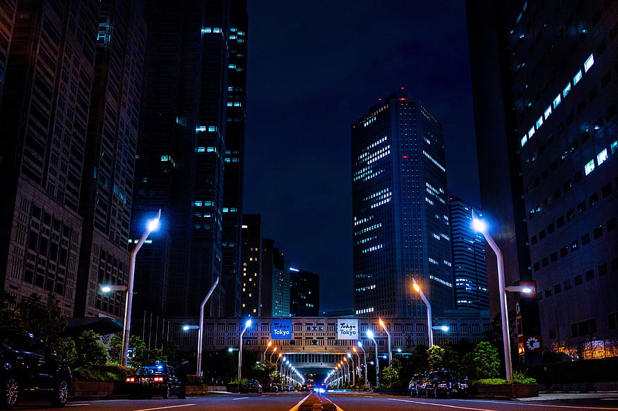 Tokyo Night Skyline with Illuminated Skyscrapers and Urban Street Lights HD wallpaper