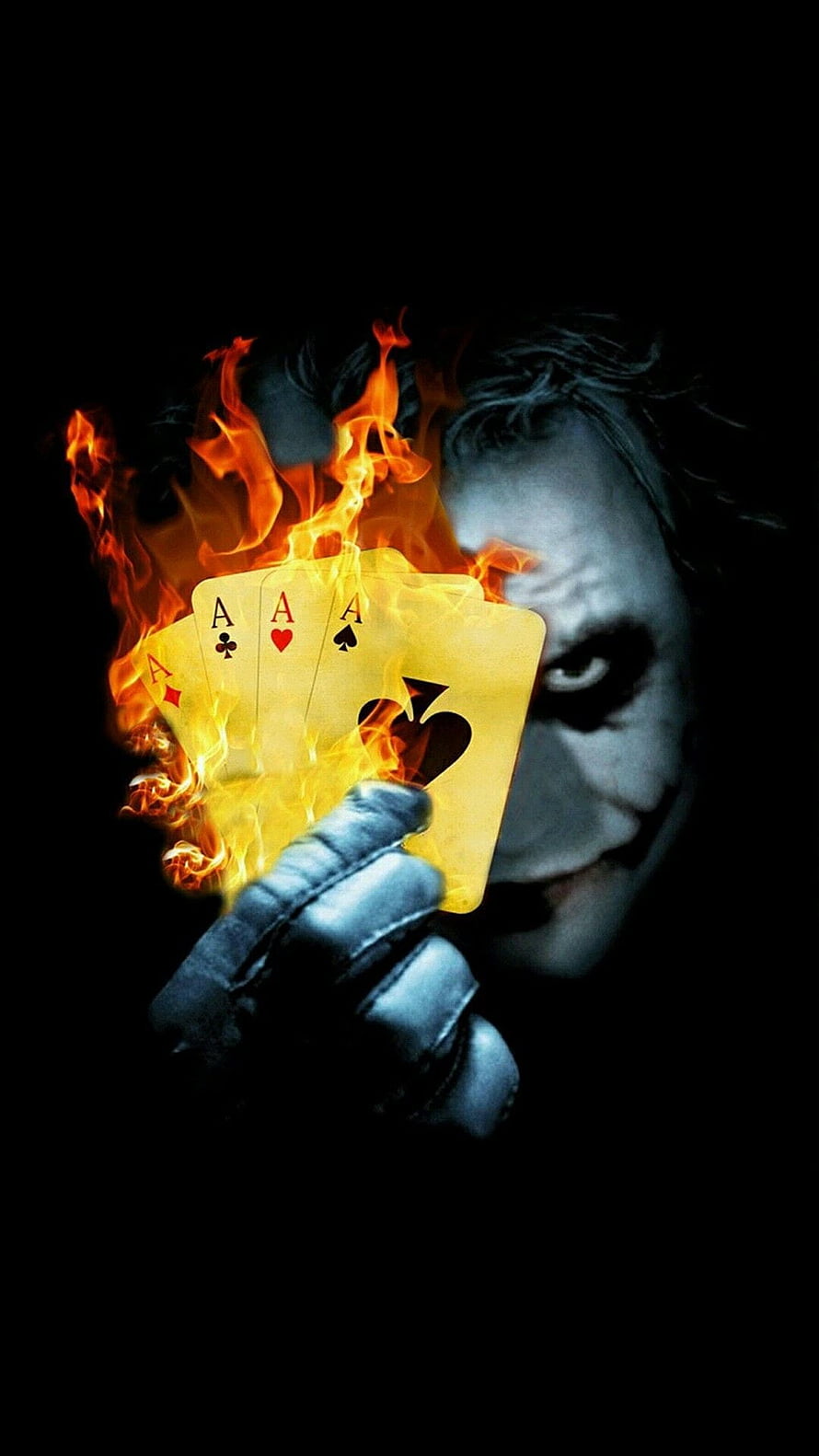 The Joker holding four burning aces in a dark cinematic portrait HD phone wallpaper