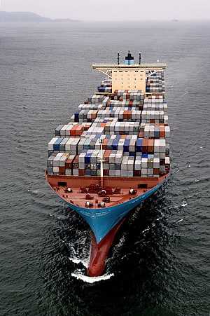 Aerial View of a Massive Maersk Container Ship Loaded with Colorful Shipping Containers on the Open Sea HD phone wallpaper