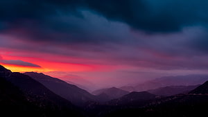 Dramatic Sunset Over Layered Mountain Ranges With Vibrant Pink And Orange Sky HD wallpaper