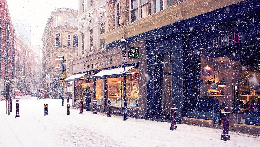 Snowy European Street Scene With Boutique Shops And Falling Snowflakes HD wallpaper