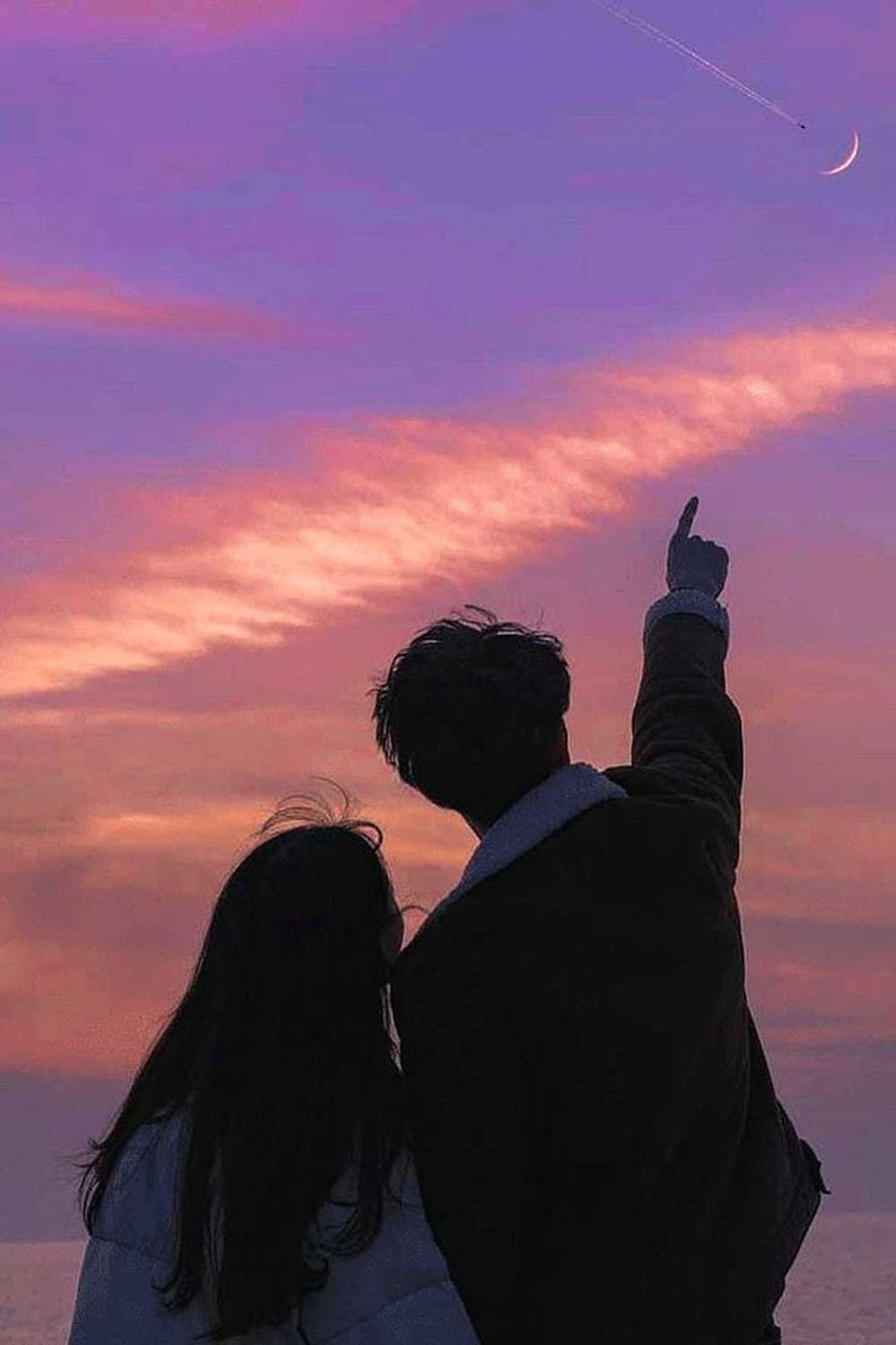 Silhouette of a couple pointing at the crescent moon and airplane trail against a purple and pink sunset sky HD phone wallpaper