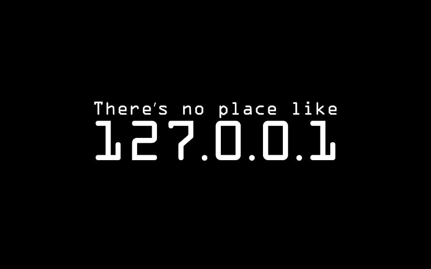 Minimalist Black Background with White Monospace Text Reading There's No Place Like 127.0.0.1 HD wallpaper