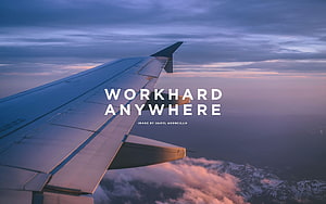 Airplane Wing Over Snowy Mountains at Sunset HD wallpaper