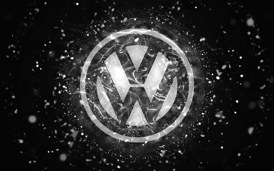 Volkswagen emblem with glowing white neon effects and particle sparks on a dark abstract background HD wallpaper