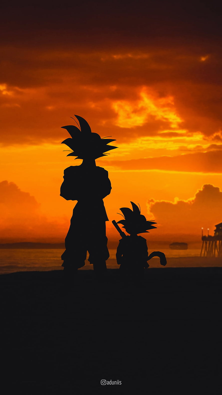 Silhouette of Goku and Kid Goku Standing on Beach at Sunset HD phone wallpaper