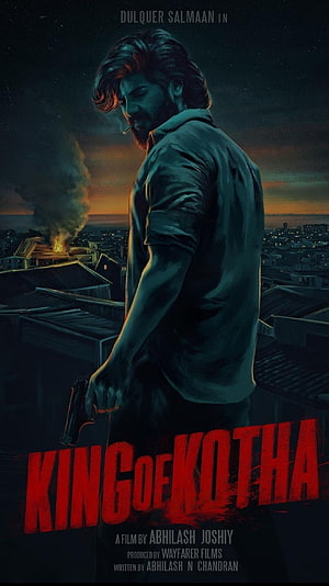 King of Kotha Movie Poster Featuring Dulquer Salmaan on a Rooftop with Gun HD phone wallpaper