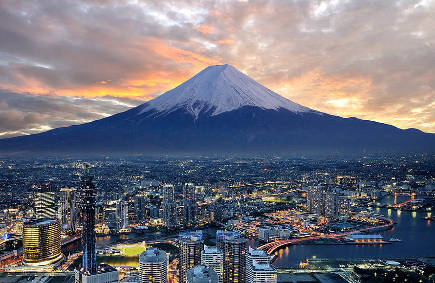 Mount Fuji Rising Over Osaka City Skyline at Sunset HD wallpaper
