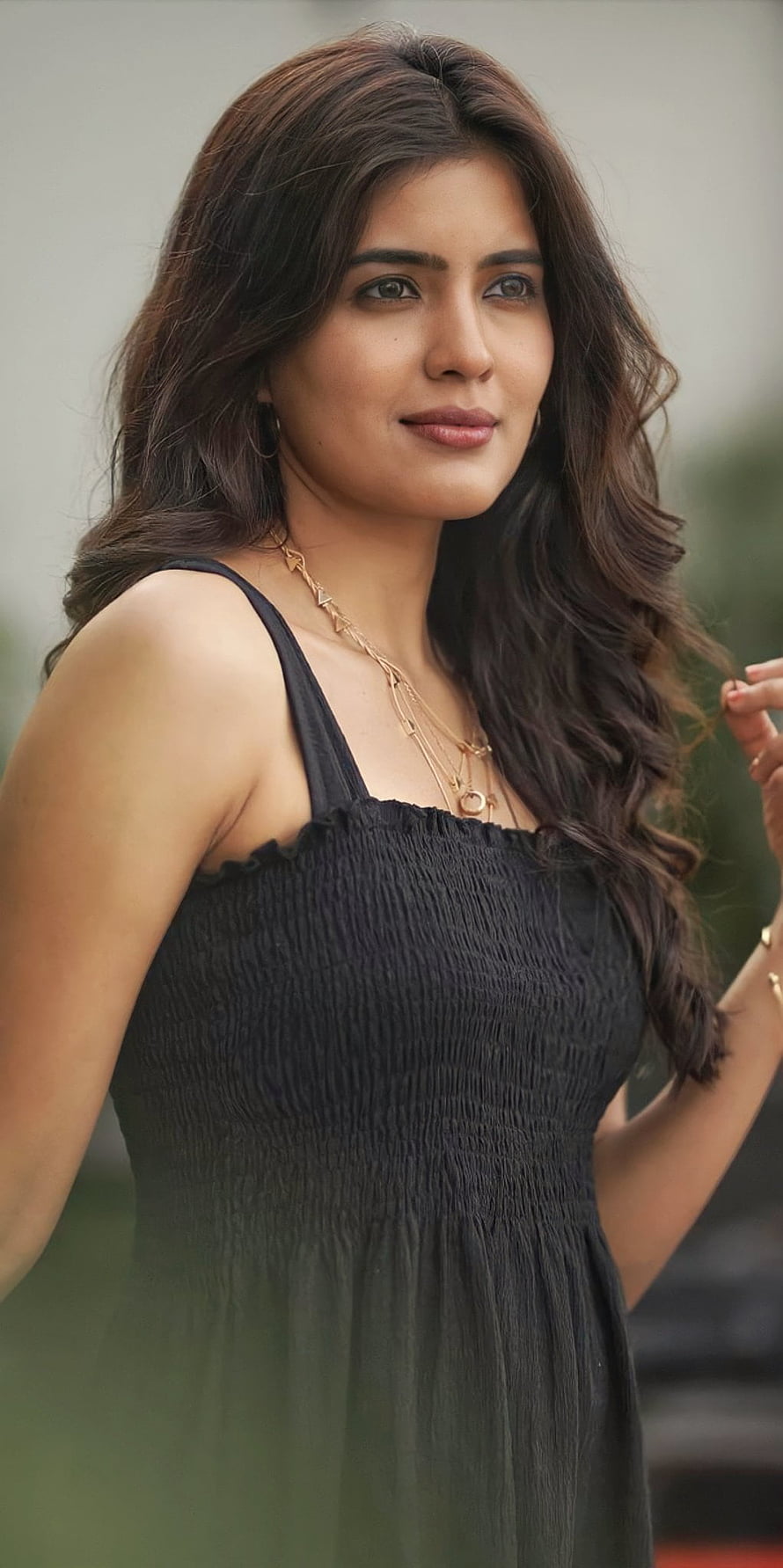 Amritha Aiyer Portrait in Black Smocked Dress with Gold Necklace HD phone wallpaper