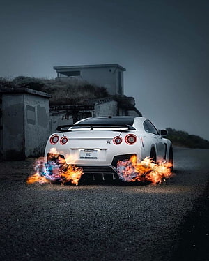 White Nissan GT-R R35 Shooting Flames From Exhaust On Road HD phone wallpaper