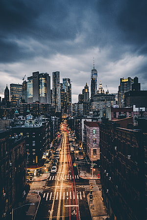 New York City Skyline at Dusk with Long Exposure Light Trails on Wet Streets HD phone wallpaper