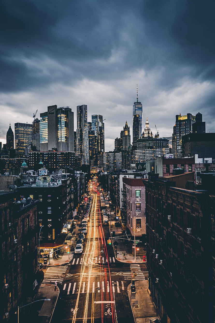 New York City Skyline at Dusk with Long Exposure Light Trails on Wet Streets HD phone wallpaper