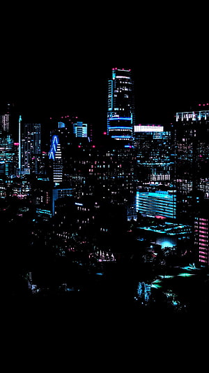 Neon-lit urban skyline at night with glowing skyscrapers and deep black sky HD phone wallpaper