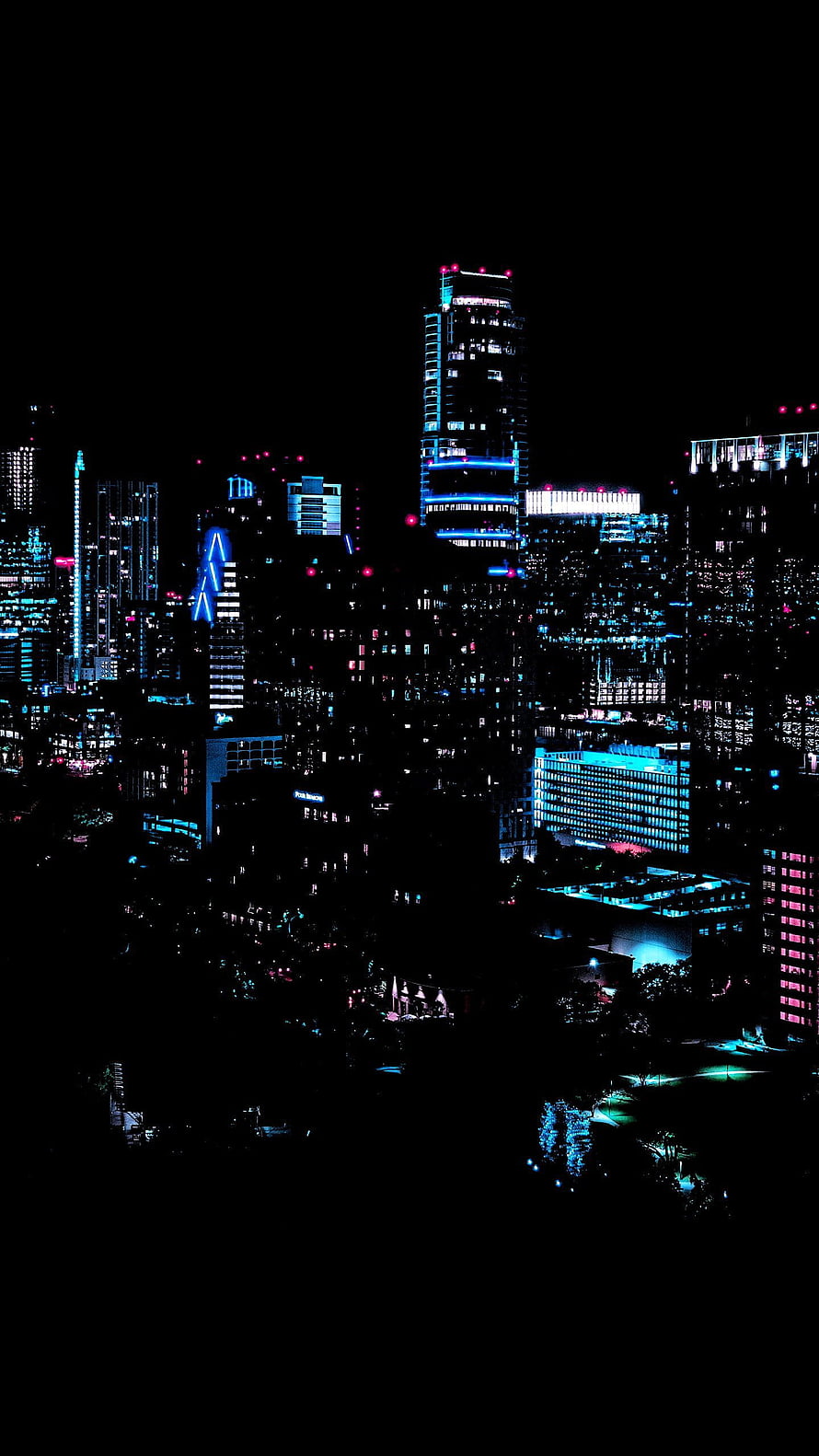 Neon-lit urban skyline at night with glowing skyscrapers and deep black sky HD phone wallpaper