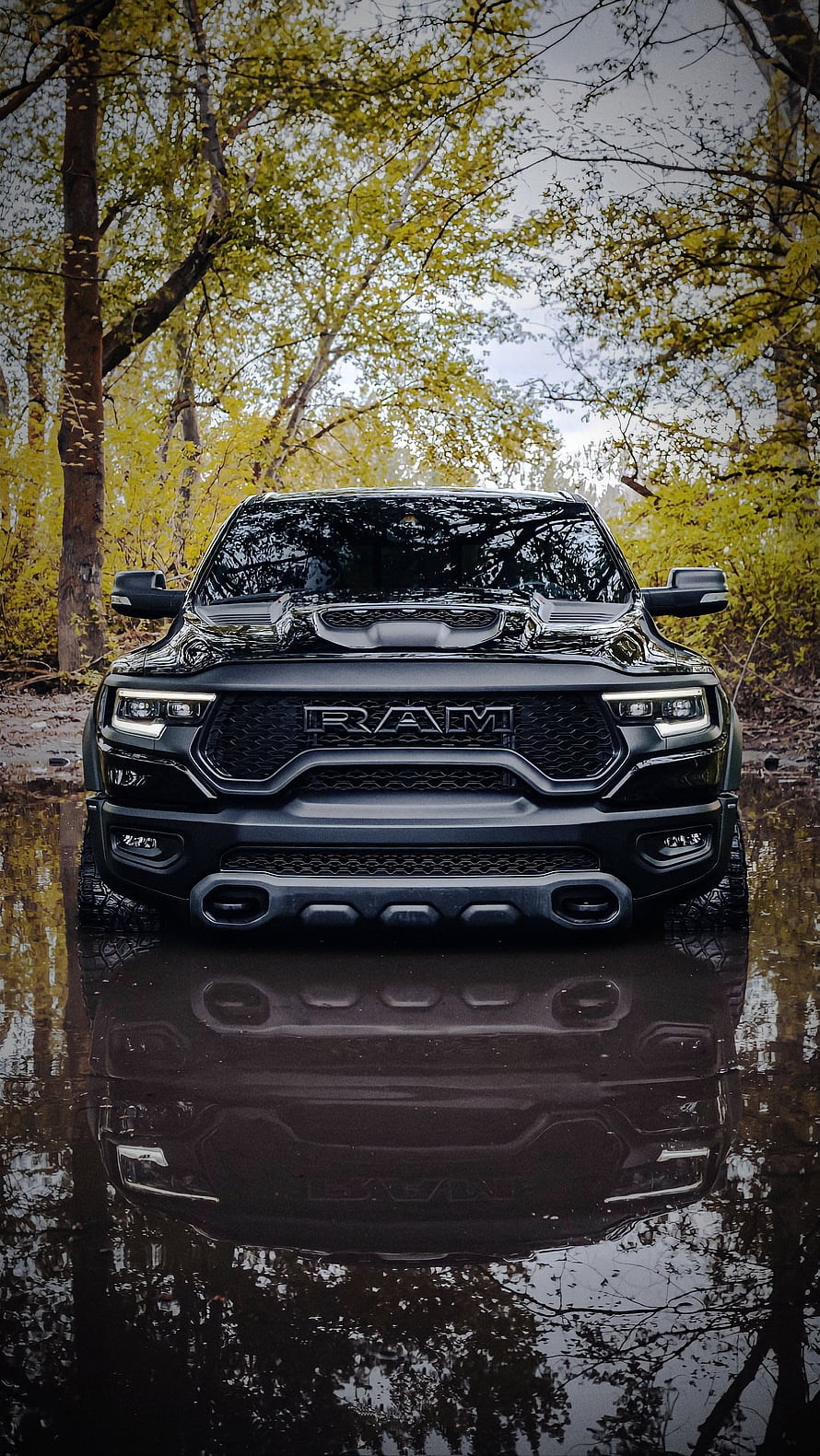 Black Ram 1500 TRX Pickup Truck Parked in Forest Water Reflection HD phone wallpaper