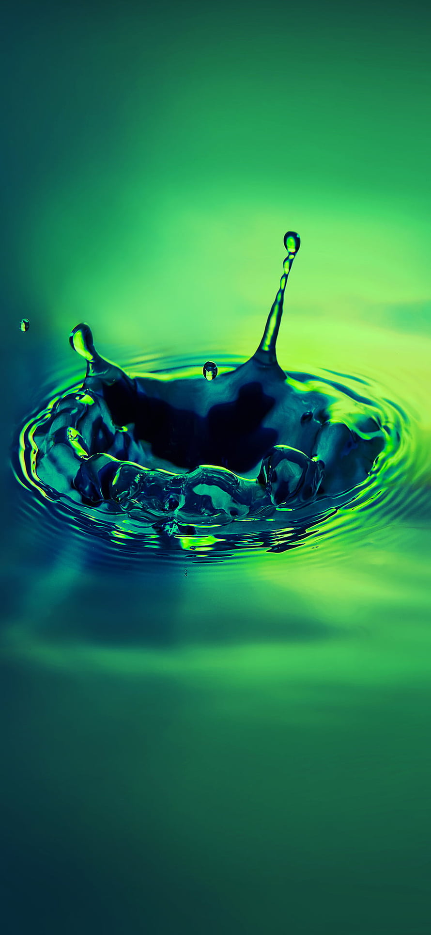 Vibrant Green Water Droplet Splash with Dynamic Ripples and Crown Formation HD phone wallpaper