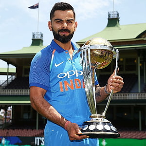 Virat Kohli Holding ICC Cricket World Cup Trophy in India Blue Jersey HD phone wallpaper