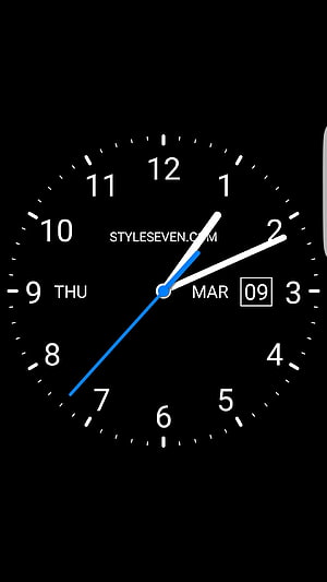 Minimalist Black Analog Clock Face with White Numerals and Blue Second Hand HD phone wallpaper