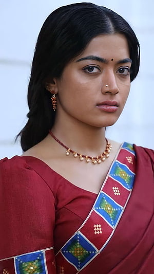 Portrait of a woman wearing a traditional red saree with blue and green geometric patterns and gold jewelry, Rashmika mandanna, srivalli, pushpa HD phone wallpaper