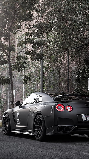 Matte Black Nissan GT-R R35 Rear Three-Quarter View with Taiga Decal and Dual Exhausts HD phone wallpaper