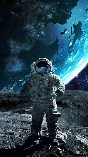 Astronaut Standing on Moon Surface with Earth in Background HD phone wallpaper