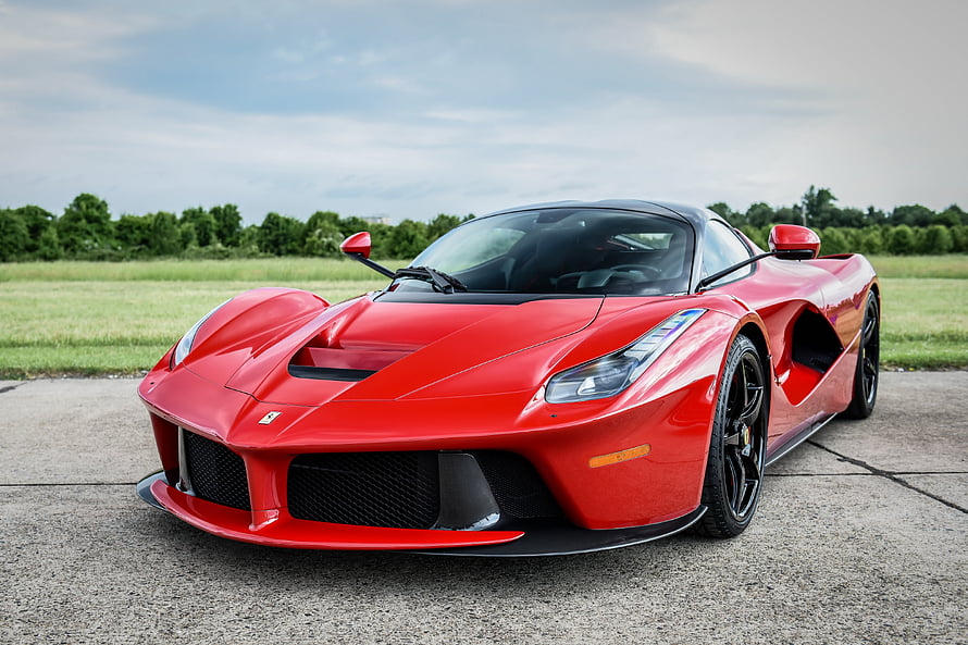 Red Ferrari LaFerrari Hypercar Front Three-Quarter View on Concrete Surface HD wallpaper