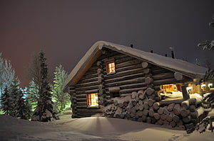 Cozy Log Cabin in Snowy Forest at Night with Warm Window Light HD wallpaper