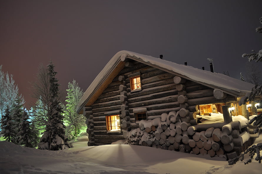 Cozy Log Cabin in Snowy Forest at Night with Warm Window Light HD wallpaper