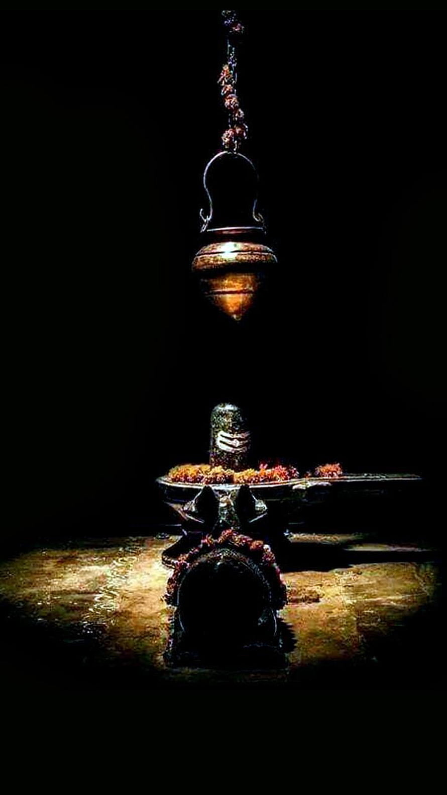 Shiva Lingam with Sacred Thread and Hanging Brass Lamp in Dark Atmosphere HD phone wallpaper